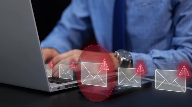 Digital security attack through phishing email on businessman laptop. Warning of data threat and cyber risk