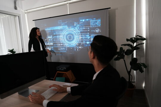 atin businesswoman programmer stands explaining a meeting dashboard with graphs and charts. Concept of data management system, business intelligence, data statistics, marketing analysis