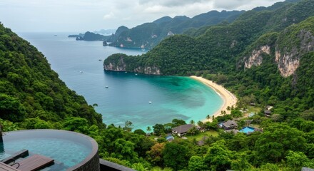 Stunning aerial view of a secluded tropical beach and turquoise bay from a luxury resort infinity pool
