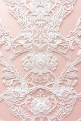 Lace patterned wall with flowers and leaves. The lace is white and the flowers are pink