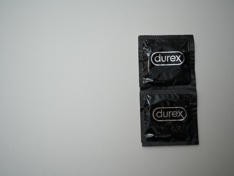 Two Durex black condom packages isolated on white background, contraception and safe sex protection concept
