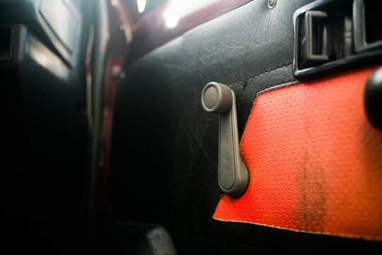 close up of window crank handle car