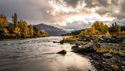 Autumn river flowing through a valley, dramatic sky