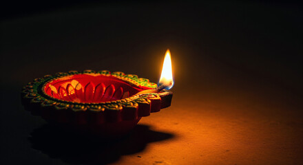 Illuminated Clay Diya with Intricate Patterns - Traditional Indian Oil Lamp