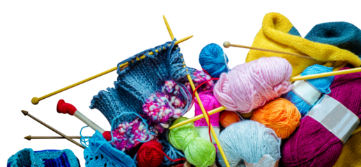 Lots of balls of wool, knitting needles and other tools.  