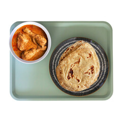 Indian roti paratha and spicy chicken curry meal