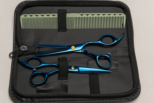 Hairdressing tools kit with blue scissors and comb