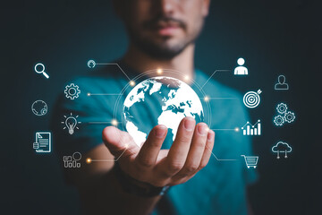 Global business technology concept man holding digital earth with marketing and network icons view