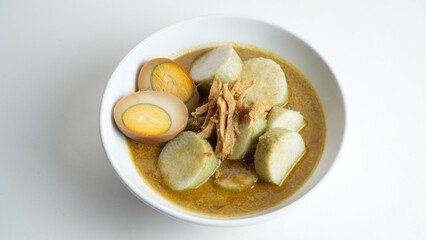 Lontong Opor,  made from chicken cooked with coconut milk and spices served with rice cake and egg