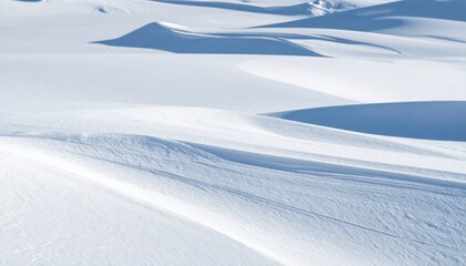 Obraz premium Minimalist White Snowdrift Landscape with Shadow Patterns on Sunny Day Serene Winter Scene of Snow Dunes Basking in Sunlight with Sharp Shadow Contrast