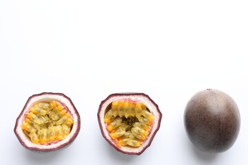 Fresh passion fruits on white background, top view. Space for text