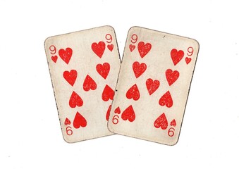 A pair of  identical vintage playing cards isolated on a white background.