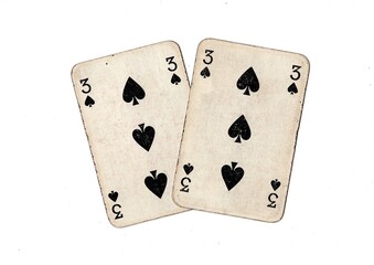 A pair of  identical vintage playing cards isolated on a white background.