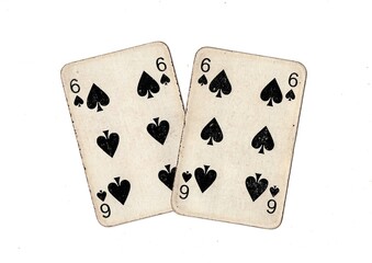 A pair of  identical vintage playing cards isolated on a white background.