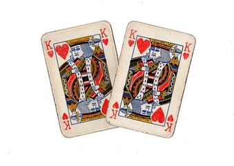 A pair of  identical vintage playing cards isolated on a white background.