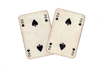 A pair of  identical vintage playing cards isolated on a white background.