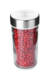 Red peppercorns in spice jar isolated on white