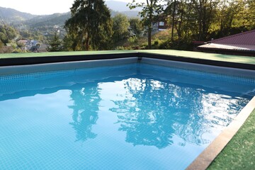 Outdoor swimming pool with clean water at resort