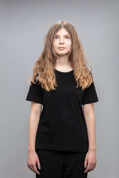 Studio portrait of teenage girl wearing a t-shirt.