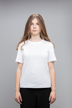 Studio portrait of teenage girl wearing a t-shirt.