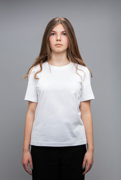 Studio portrait of teenage girl wearing a t-shirt.