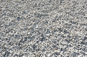 Abstract background of broken gravel stones, stones of different sizes and shapes