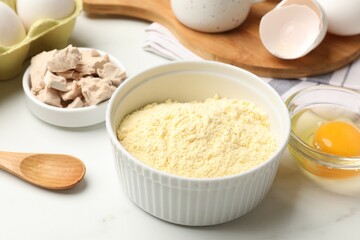 Making cornbread. Different ingredients on white marble table, closeup