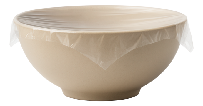 A traditional wooden spice grinder filled with a mixed pepper blend ready for use.