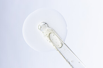 A sample of cosmetic serum for the face or moisturizing gel with a pipette