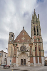 Fototapeta premium Vertical view of the facade of landmark Saint Hilaire church, Agen, Lot-et Garonne, France