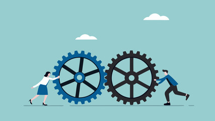 cooperation in a business setting, teamwork to reach success together, cohesiveness or synergy, help each other in work, business people push gear cogwheels together leading to success © MdHasibulHasan