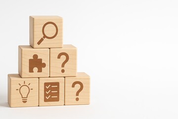Wooden Blocks with Symbols of Search, Puzzle, Idea, and Checklist on White Background