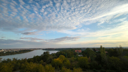 landscape by the Danube river in Novi Sad in autumn, with beautiful small white clouds