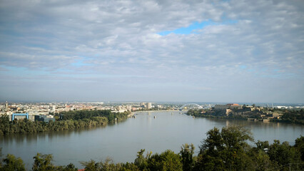landscape by the Danube river in Novi Sad in autumn, with beautiful small white clouds