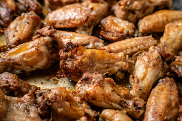Grilled chicken wings with golden crust