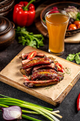 Grilled pork ribs with chili pepper and herbs
