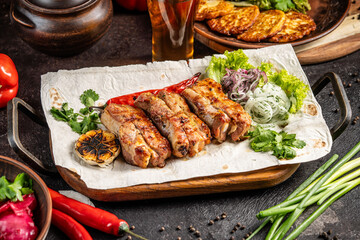 Grilled pork kebab with vegetables and herbs