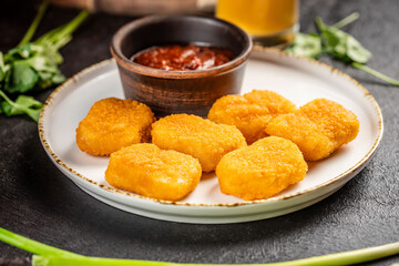 Crispy golden chicken nuggets with sauce