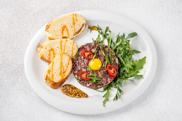 Beef tartare with egg yolk and toast