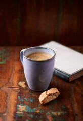 Cup of coffee on rustic wooden background. Soft focus. Copy space	