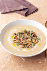Mushroom cream soup with champignons and thyme. Healthy diet. Vegetarian food.
