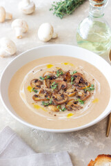 Mushroom cream soup with champignons and thyme. Healthy diet. Vegetarian food.