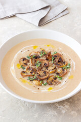 Mushroom cream soup with champignons and thyme. Healthy diet. Vegetarian food.