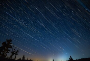 In the quiet mountain countryside, countless stars sparkle across the night sky, filling the heavens with wonder.
