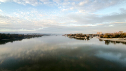 landscape by the Danube river in Novi Sad in autumn, with clouds reflected in the water