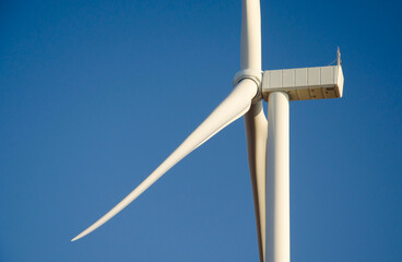 Renewable energy. Wind power plant in autumn field during sunrise.Building wind turbines. Wind turbine base.