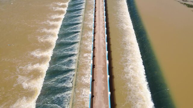 Polluted water dumping in river, chemical waste fast fashion industry Cambodia, aerial drone