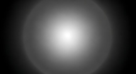 Abstract grayscale image with a central bright circular light