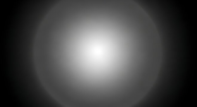 Abstract grayscale image with a central bright circular light