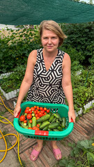 Middle-aged Caucasian woman harvests vibrant summer vegetables, echoing Earth Day's verdant spirit...